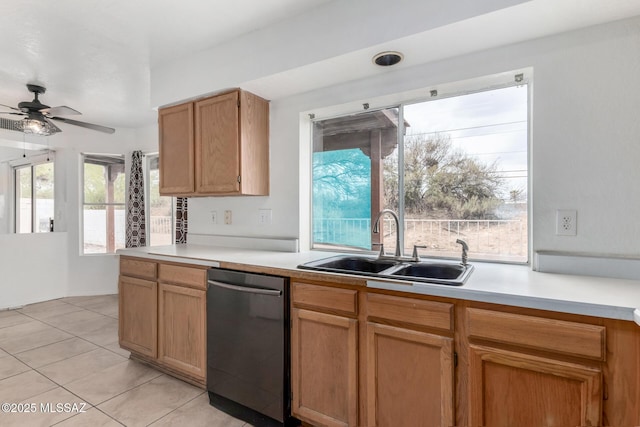 kitchen featuring light tile patterned flooring, ceiling fan, black dishwasher, and sink