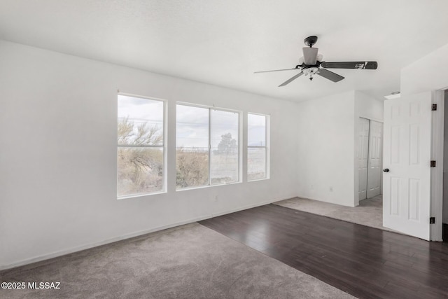 empty room featuring dark hardwood / wood-style floors and ceiling fan