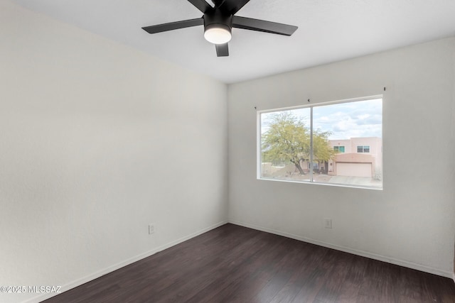 unfurnished room featuring dark hardwood / wood-style flooring and ceiling fan