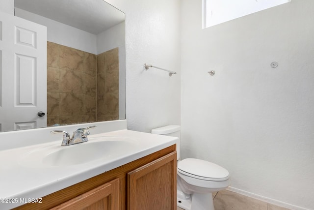 bathroom featuring vanity, toilet, and tile patterned flooring