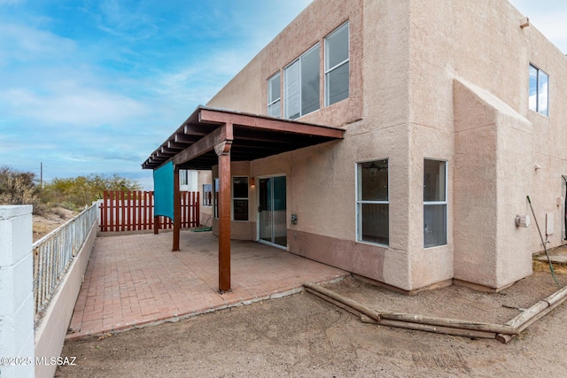 rear view of house featuring a patio