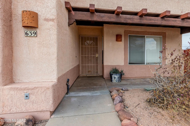 entrance to property with a patio area