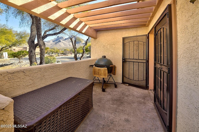 exterior space with a mountain view and a pergola