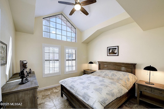 bedroom featuring ceiling fan, high vaulted ceiling, light tile patterned floors, and baseboards