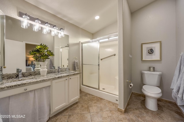 bathroom with a shower with door, vanity, vaulted ceiling, tile patterned floors, and toilet