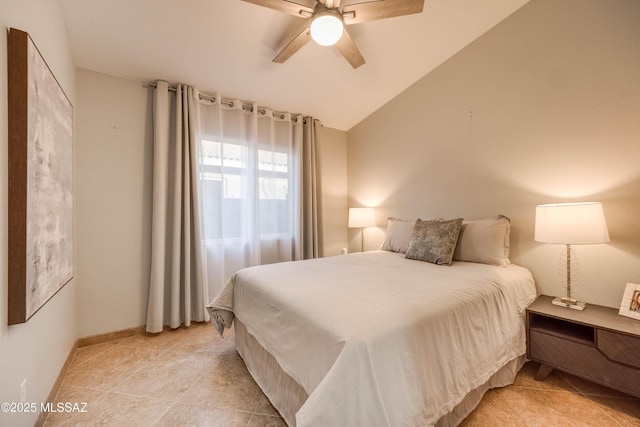 bedroom featuring ceiling fan and vaulted ceiling