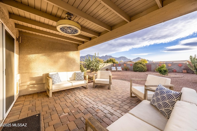 view of patio / terrace featuring a mountain view and an outdoor hangout area