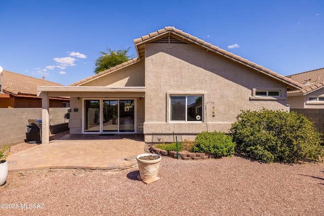 rear view of house featuring a patio