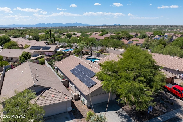 birds eye view of property with a mountain view