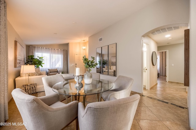 dining space featuring light tile patterned floors