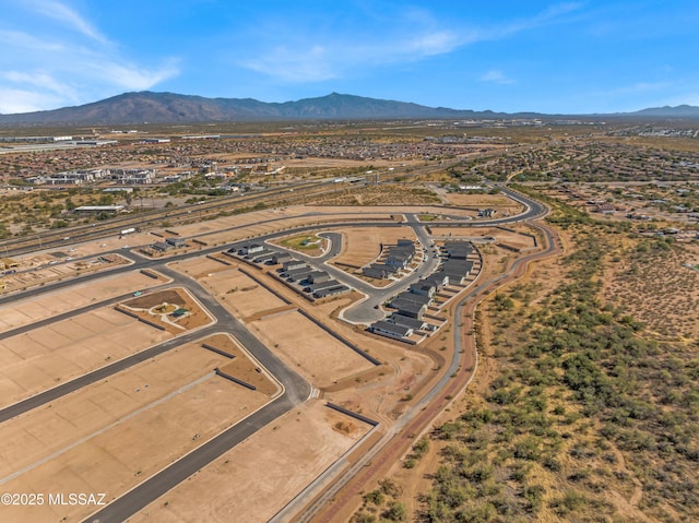 birds eye view of property with a mountain view