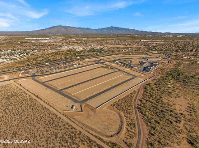 birds eye view of property with a mountain view