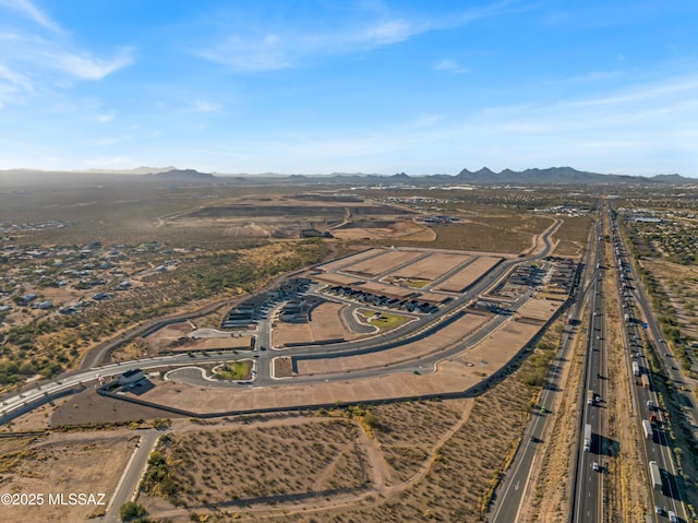 birds eye view of property featuring a mountain view