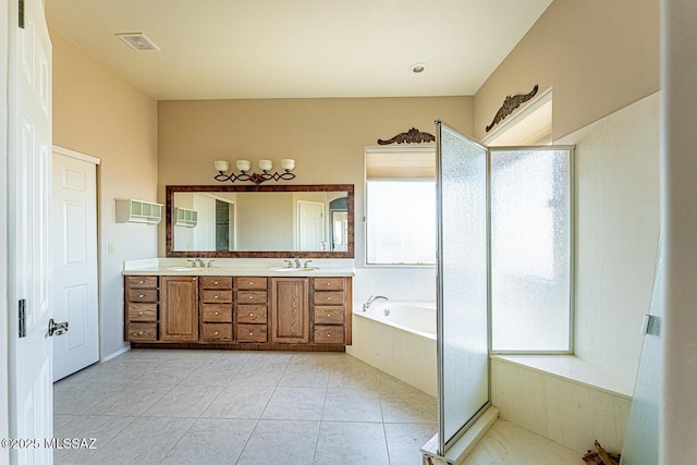 bathroom featuring vanity, tile patterned floors, and plus walk in shower