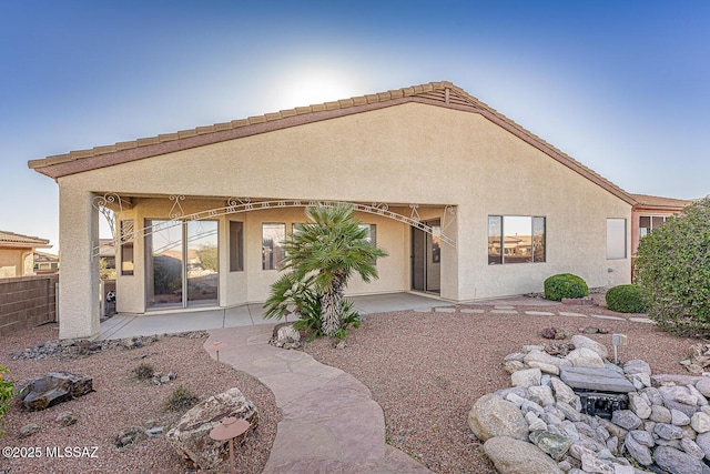 rear view of house featuring a patio