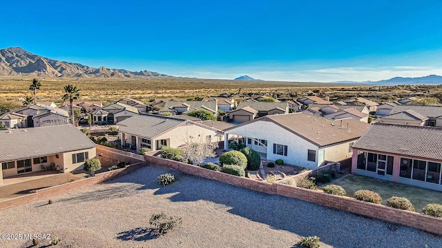 birds eye view of property with a mountain view