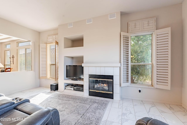 living room featuring a fireplace