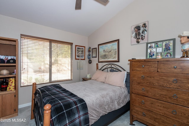 carpeted bedroom featuring vaulted ceiling and ceiling fan