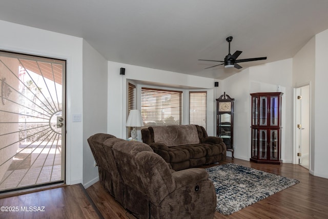 living room featuring ceiling fan, lofted ceiling, plenty of natural light, and dark hardwood / wood-style floors