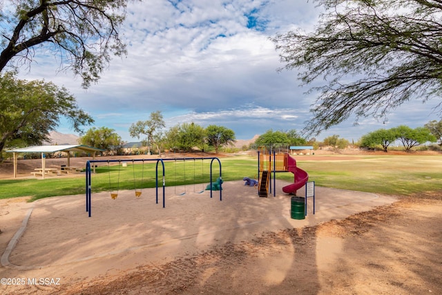 view of community featuring a playground and a yard