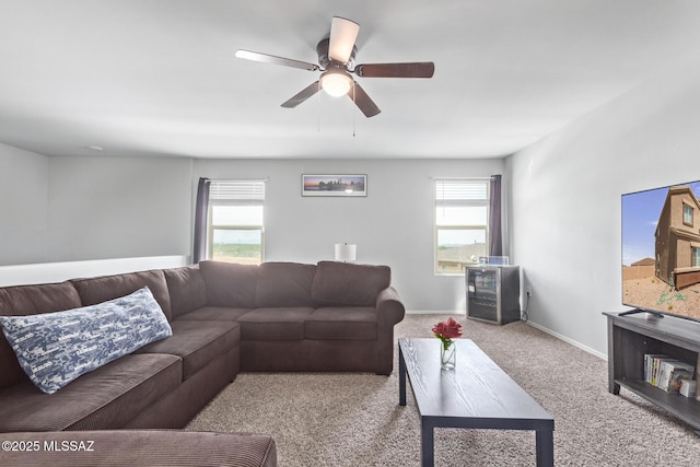 living room featuring ceiling fan and light carpet