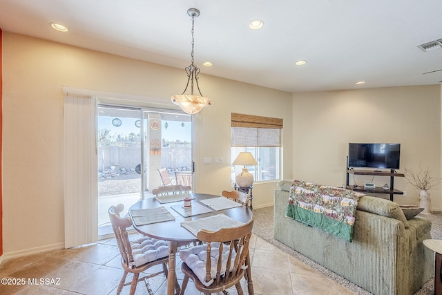 dining space featuring light tile patterned floors