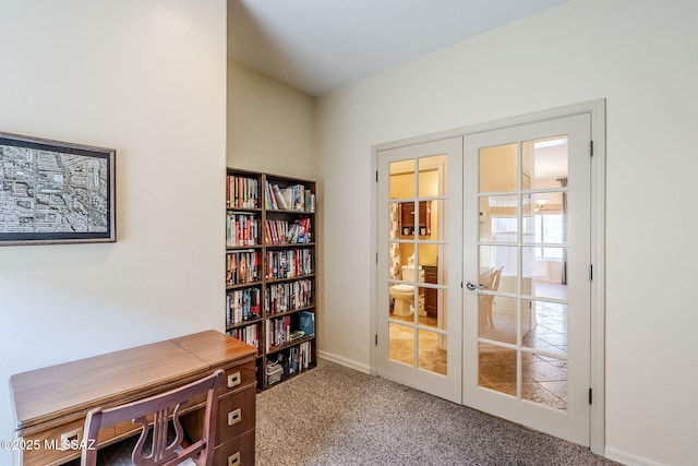 carpeted office space with french doors