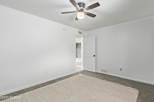 empty room featuring ceiling fan and carpet floors