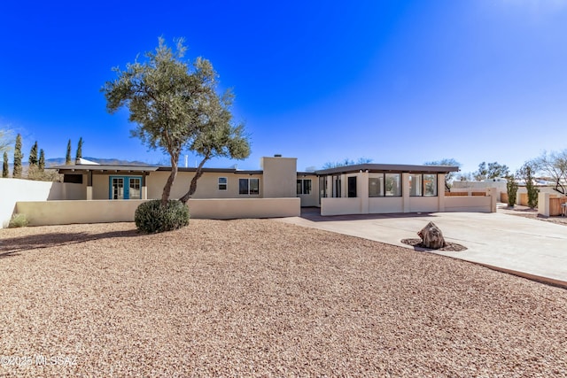 back of property featuring a patio