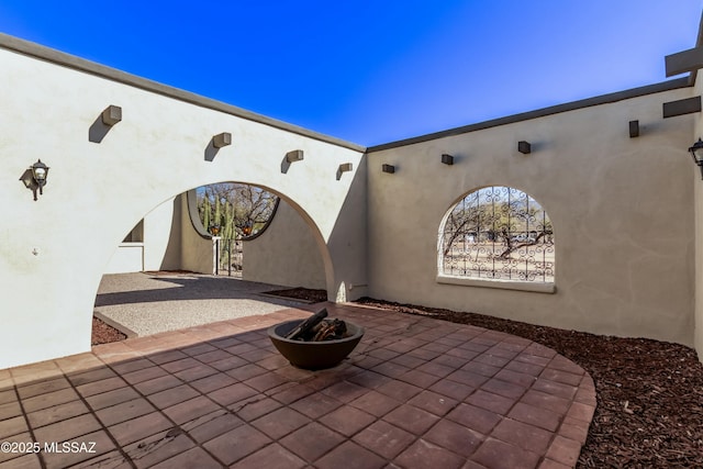 view of patio featuring an outdoor fire pit