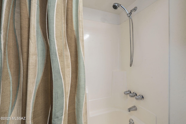 bathroom featuring shower / tub combo with curtain