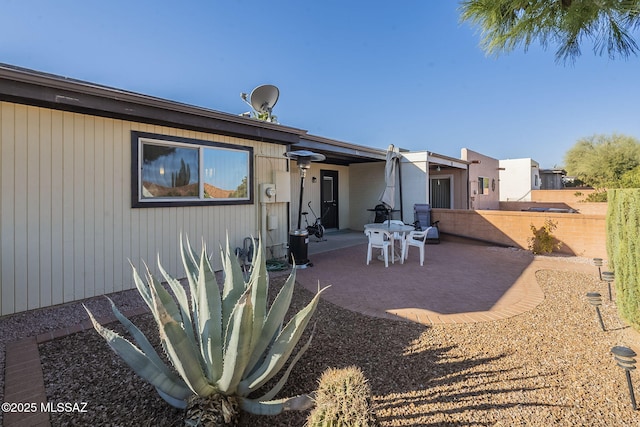 rear view of property featuring a patio