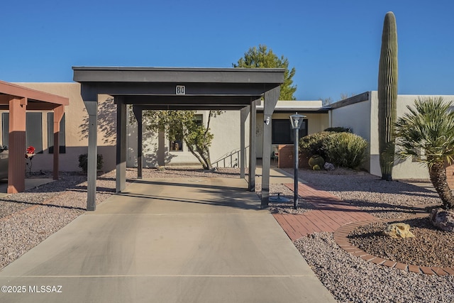 view of front of property featuring a carport