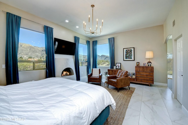 bedroom with arched walkways, marble finish floor, recessed lighting, a lit fireplace, and baseboards