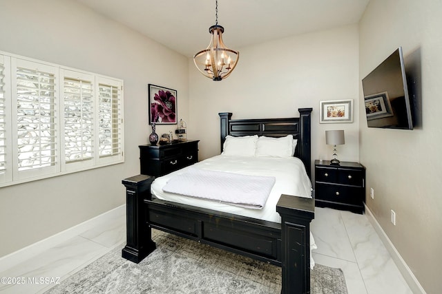 bedroom with marble finish floor, baseboards, and an inviting chandelier