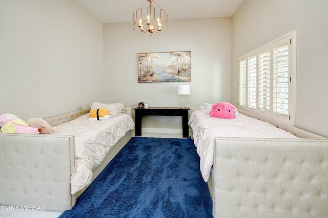 bedroom featuring an inviting chandelier