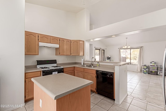 kitchen featuring pendant lighting, dishwasher, sink, kitchen peninsula, and gas range