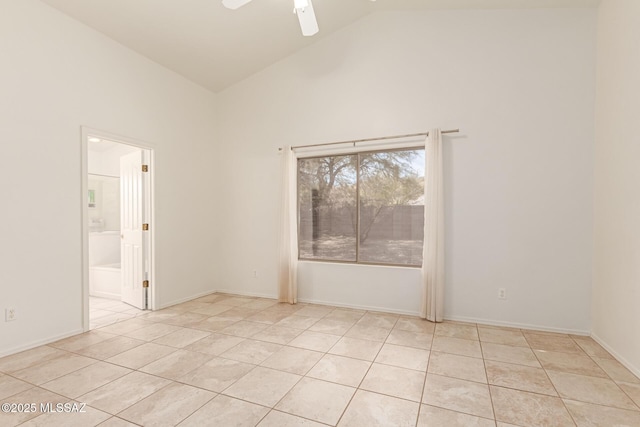 tiled empty room featuring ceiling fan and high vaulted ceiling