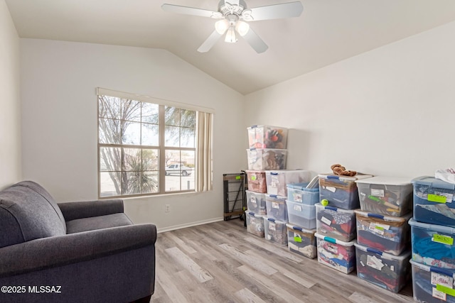 sitting room with ceiling fan, lofted ceiling, and light hardwood / wood-style floors