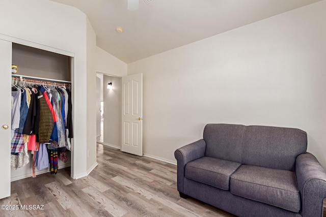 sitting room with lofted ceiling and light hardwood / wood-style floors