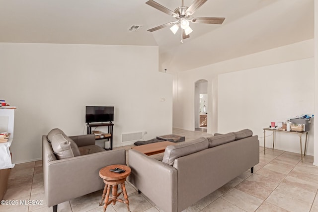 living room with lofted ceiling, light tile patterned floors, and ceiling fan