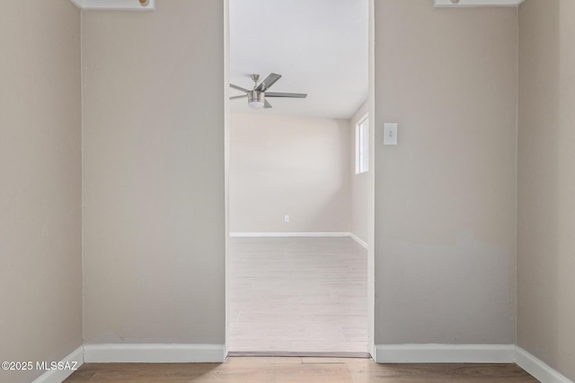 unfurnished room with hardwood / wood-style flooring and ceiling fan