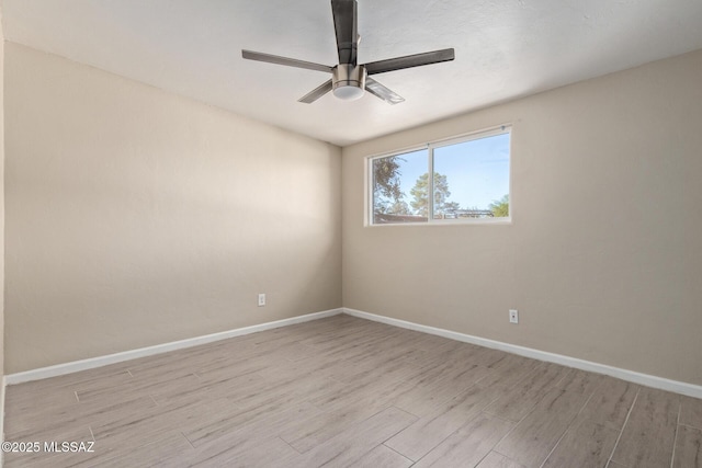 unfurnished room featuring ceiling fan and light hardwood / wood-style floors