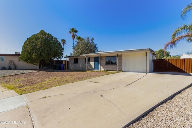 ranch-style house featuring a garage