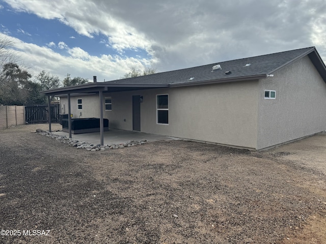 rear view of house featuring a patio