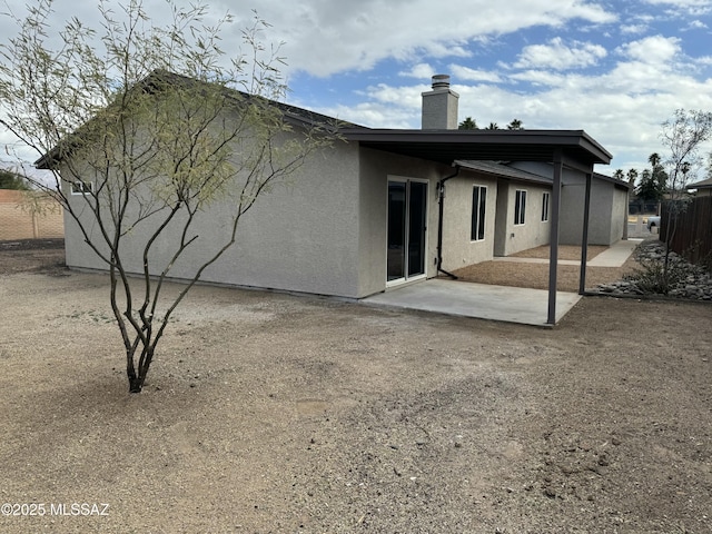 back of property featuring a patio