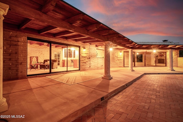 view of patio terrace at dusk