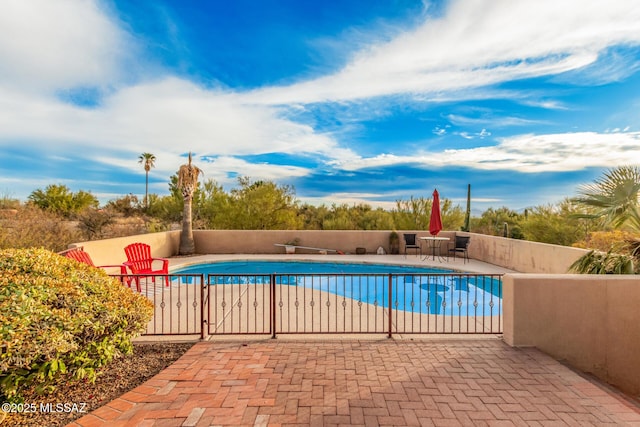 view of swimming pool featuring a patio area