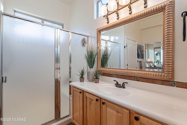 bathroom with vanity and walk in shower