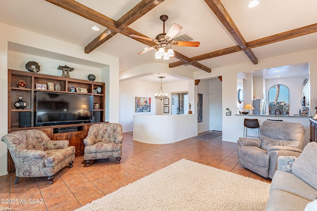 tiled living room featuring beamed ceiling, coffered ceiling, and ceiling fan with notable chandelier